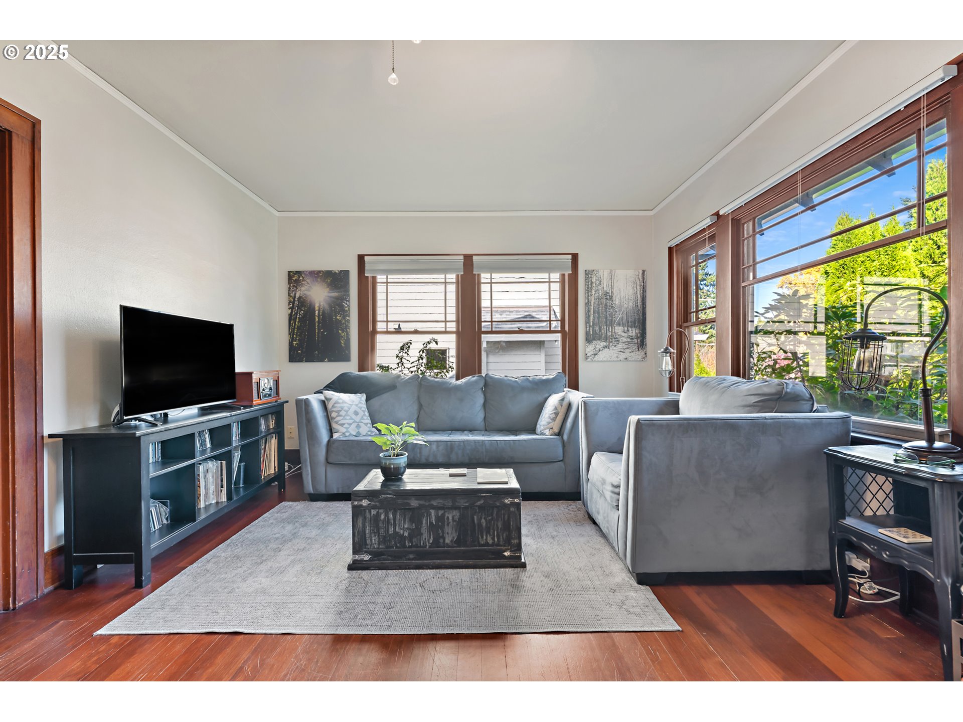 9670 Southwest Frewing Street Portland, OR 97223 - Photo 3 of 40 a living room with furniture and a flat screen tv