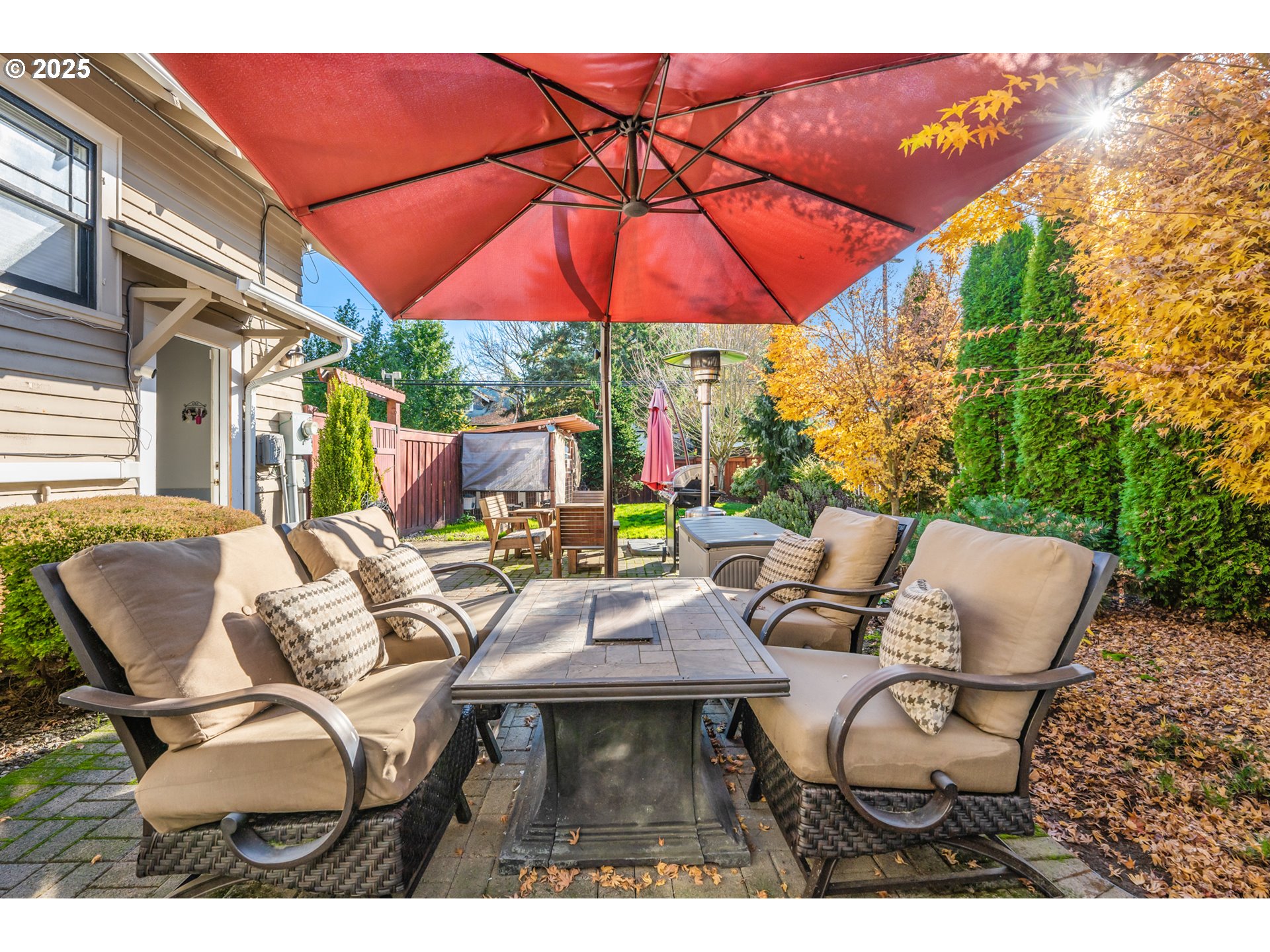 9670 Southwest Frewing Street Portland, OR 97223 - Photo 37 of 40 a balcony with table and chairs under an umbrella