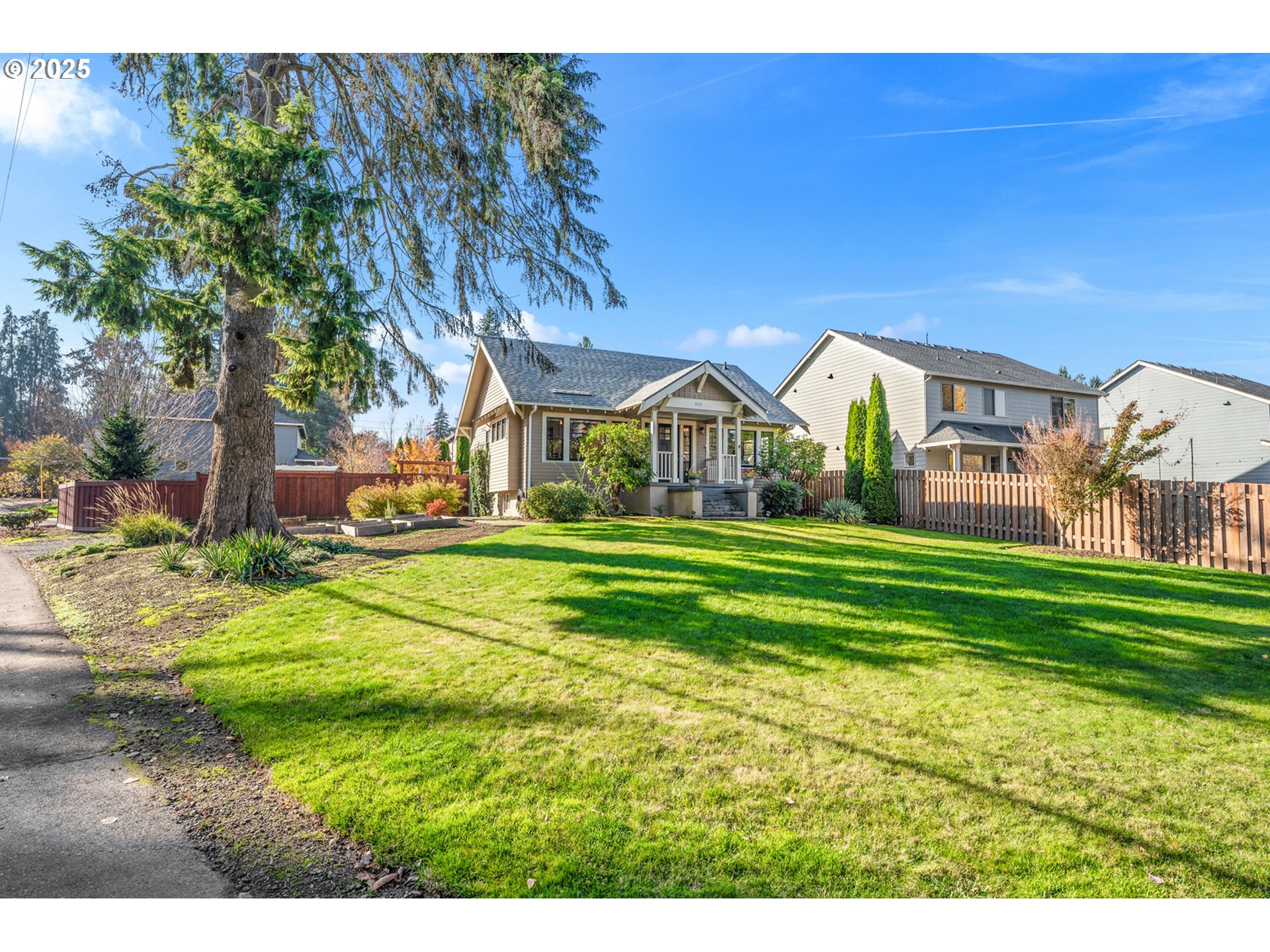 9670 Southwest Frewing Street Portland, OR 97223 - Photo 38 of 40 a view of an house with backyard space and garden