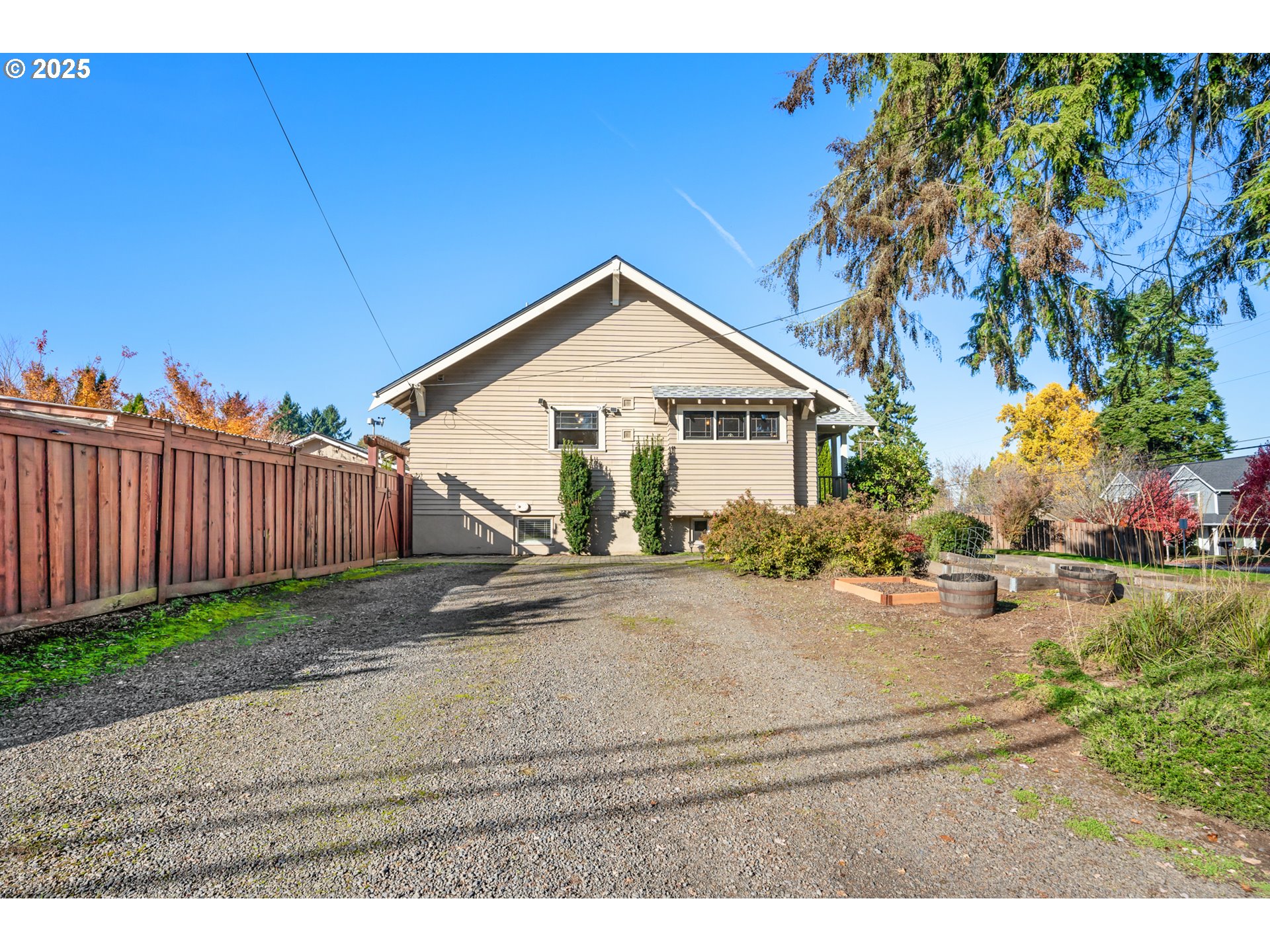 9670 Southwest Frewing Street Portland, OR 97223 - Photo 39 of 40 a view of a house with backyard and trees