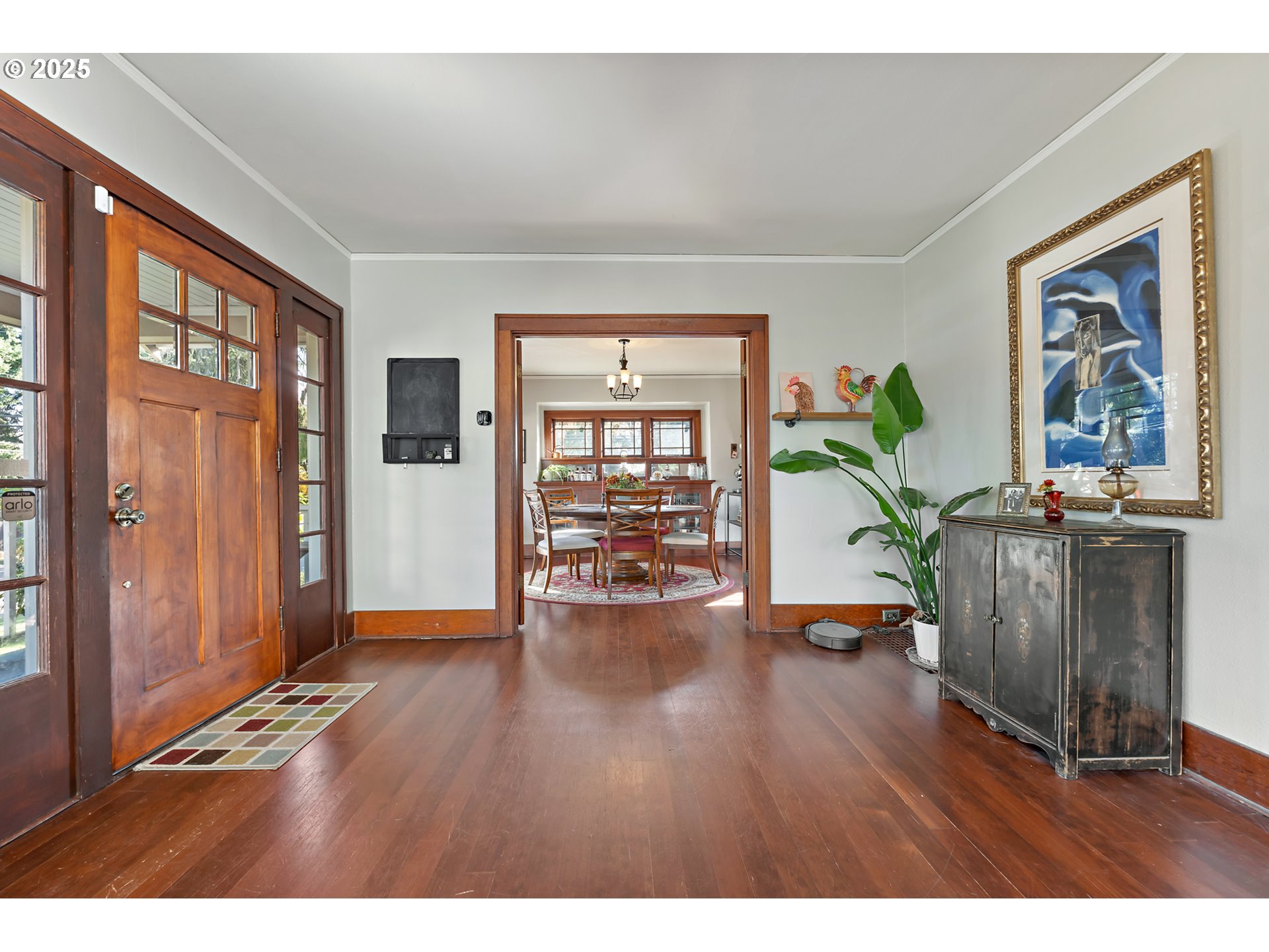 9670 Southwest Frewing Street Portland, OR 97223 - Photo 8 of 40 a living room with hardwood floor and a potted plant