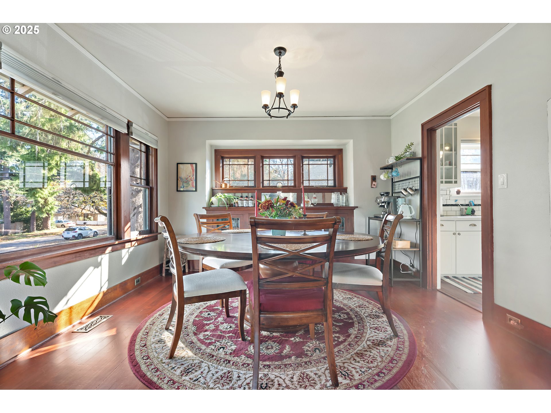 9670 Southwest Frewing Street Portland, OR 97223 - Photo 9 of 40 a dining room with furniture a chandelier and wooden floor