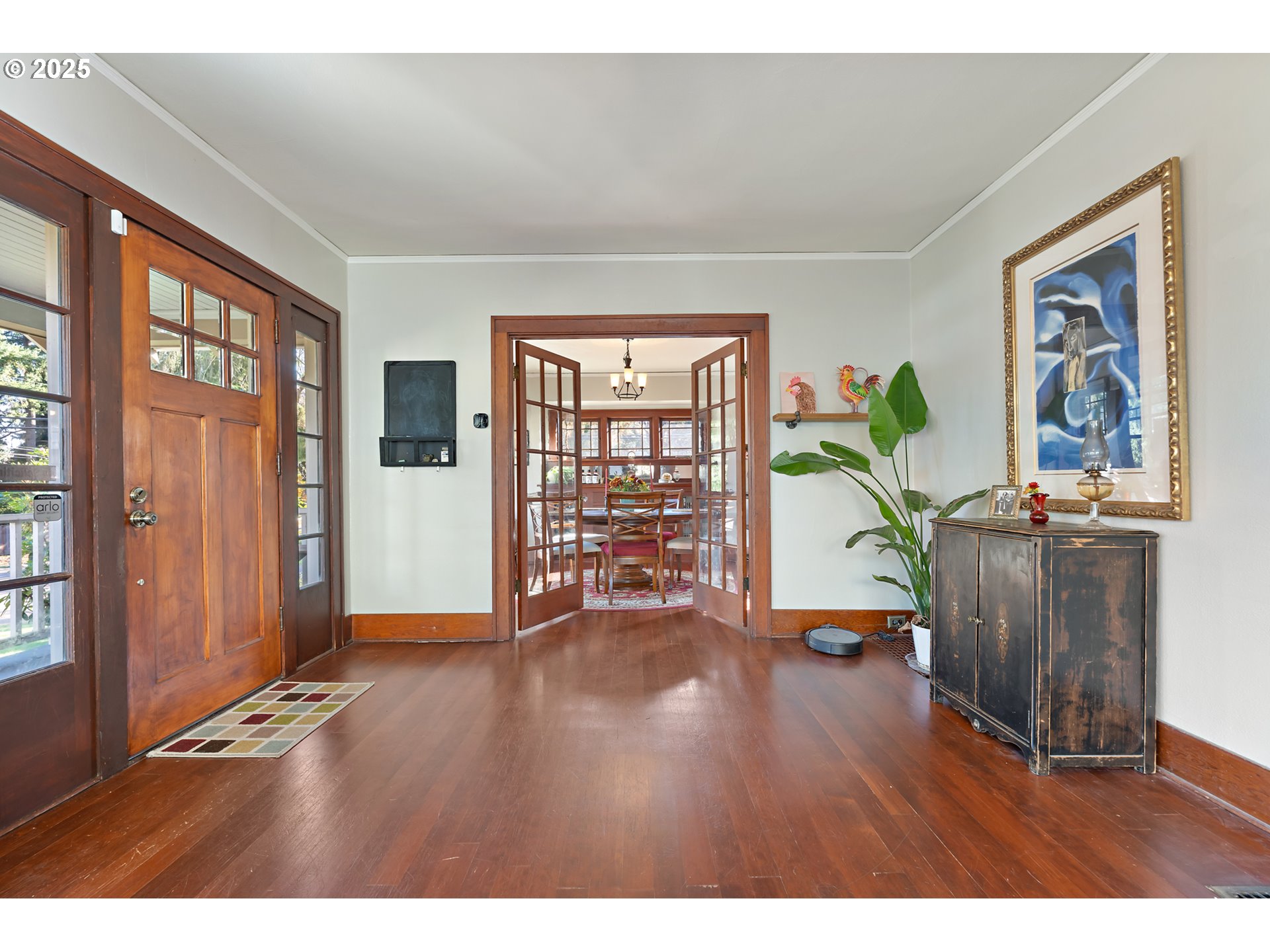 9670 Southwest Frewing Street Portland, OR 97223 - Photo 10 of 40 a view of an empty room with wooden floor and a window