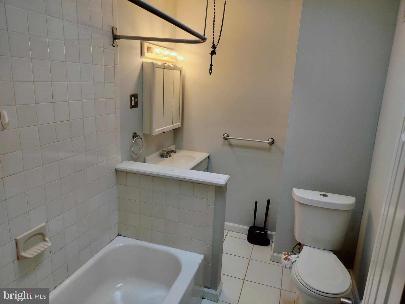 2143 South Beechwood Street Philadelphia, PA 19145 - Photo 9 of 14 a bathroom with a sink a toilet and shower