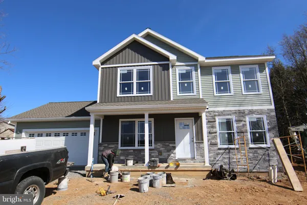 a front view of a house with parking