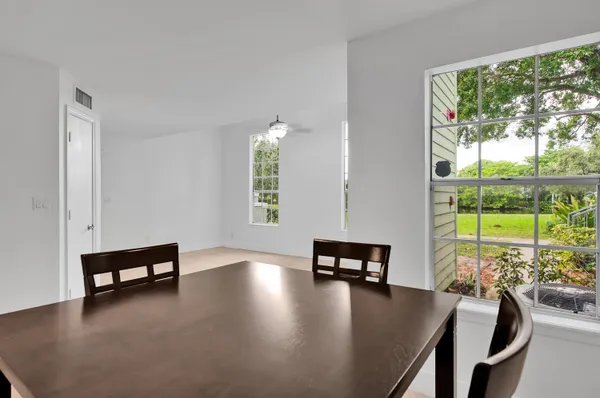a view of a dining room with furniture window and outside view