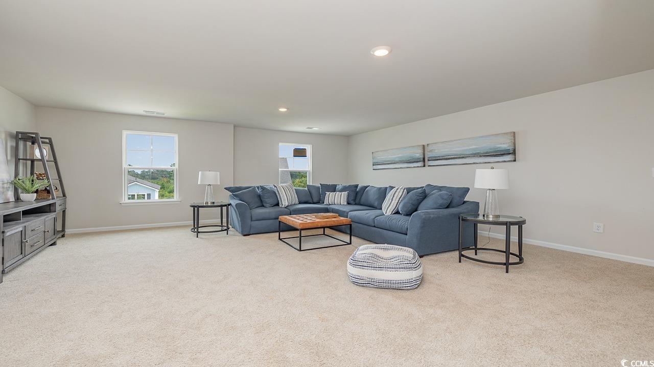 303 Ridley Street Longs, SC 29568 - Photo 22 of 31 Living room featuring light colored carpet and recessed lighting