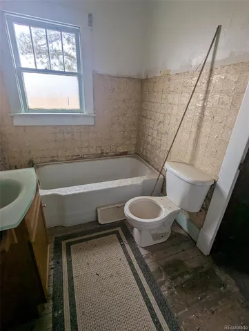 a bathroom with a toilet and a sink
