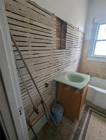 a bedroom with furniture and windows