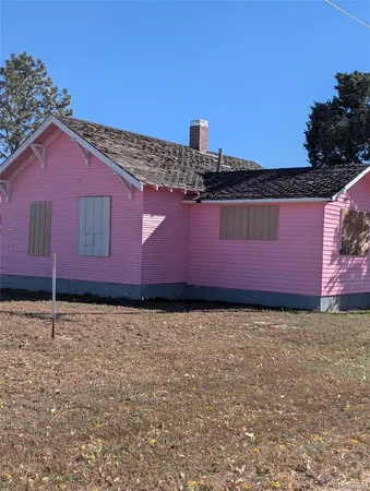 a view of a pathway with a building in the background