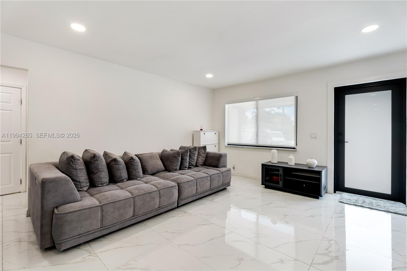 5635 Pierce Street Hollywood, FL 33021 - Photo 12 of 27 a living room with furniture and a couch
