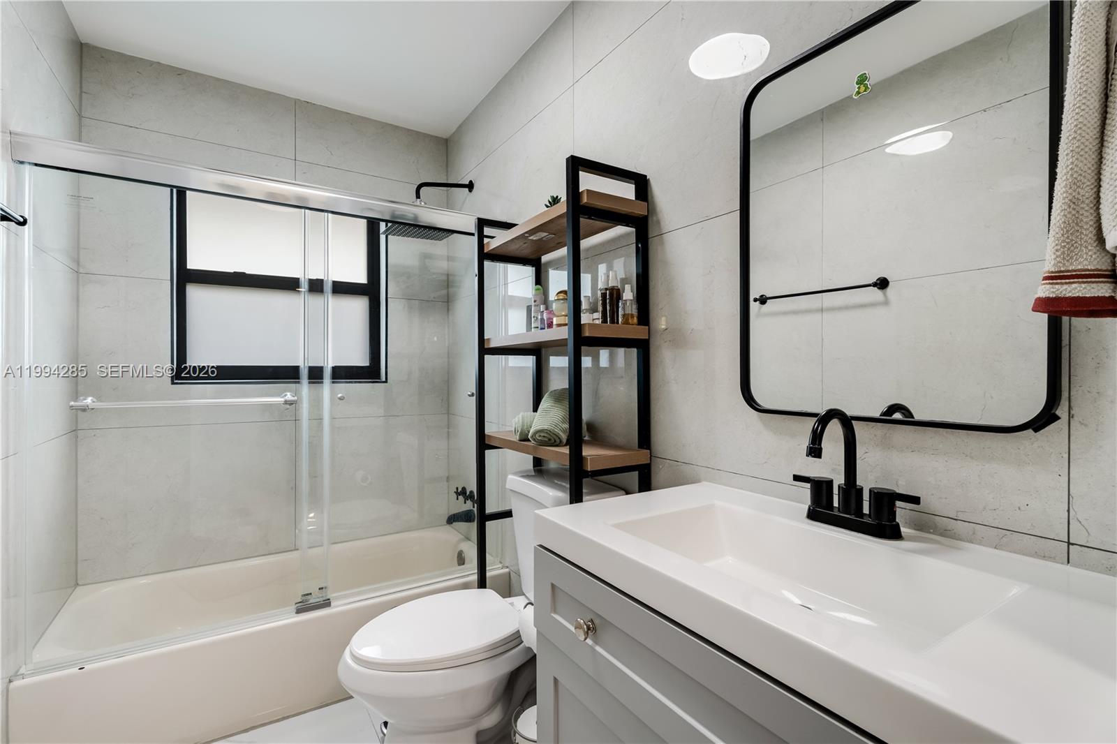5635 Pierce Street Hollywood, FL 33021 - Photo 20 of 27 a bathroom with a sink toilet and shower
