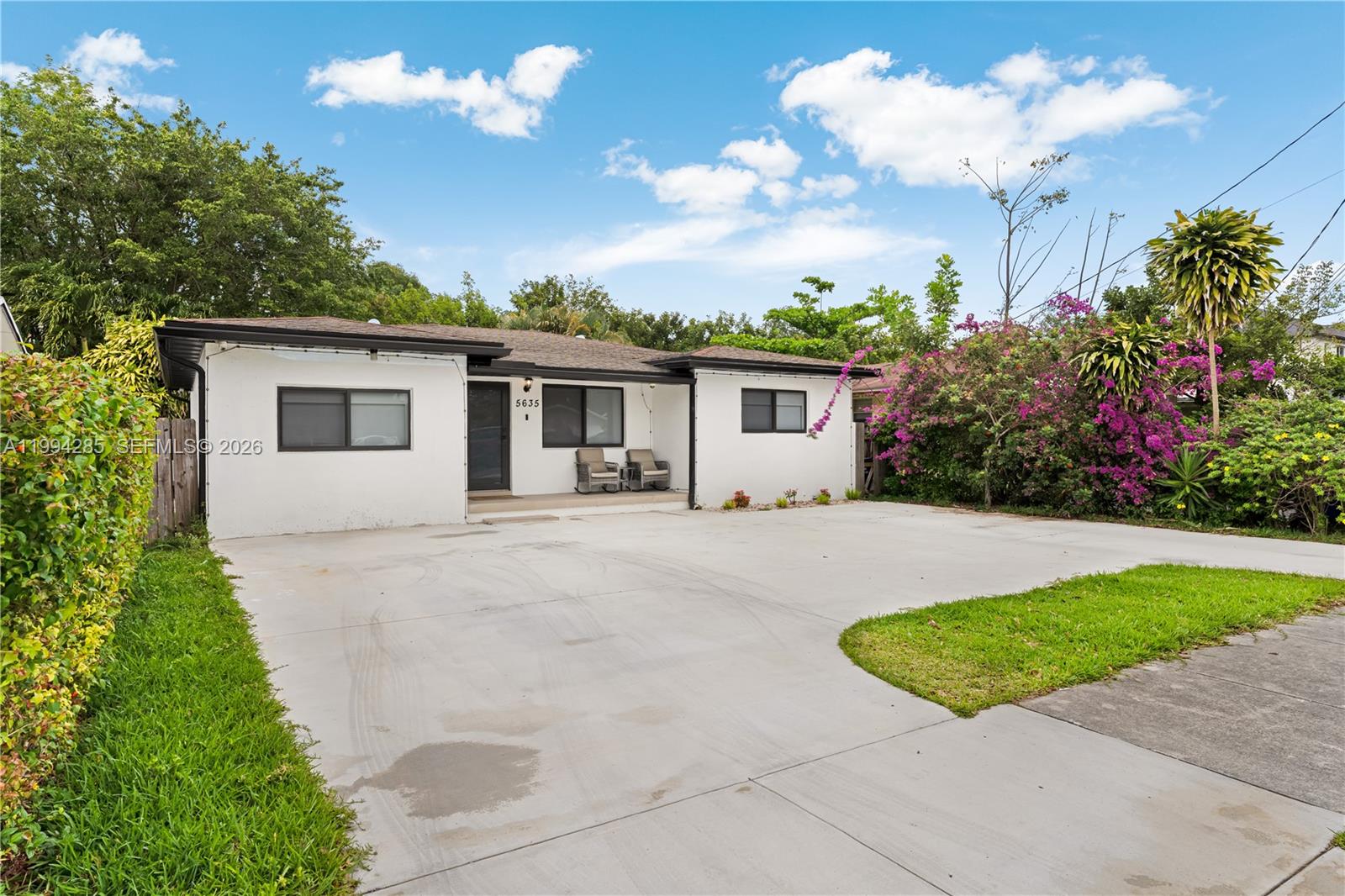 5635 Pierce Street Hollywood, FL 33021 - Photo 2 of 27 a front view of house with yard