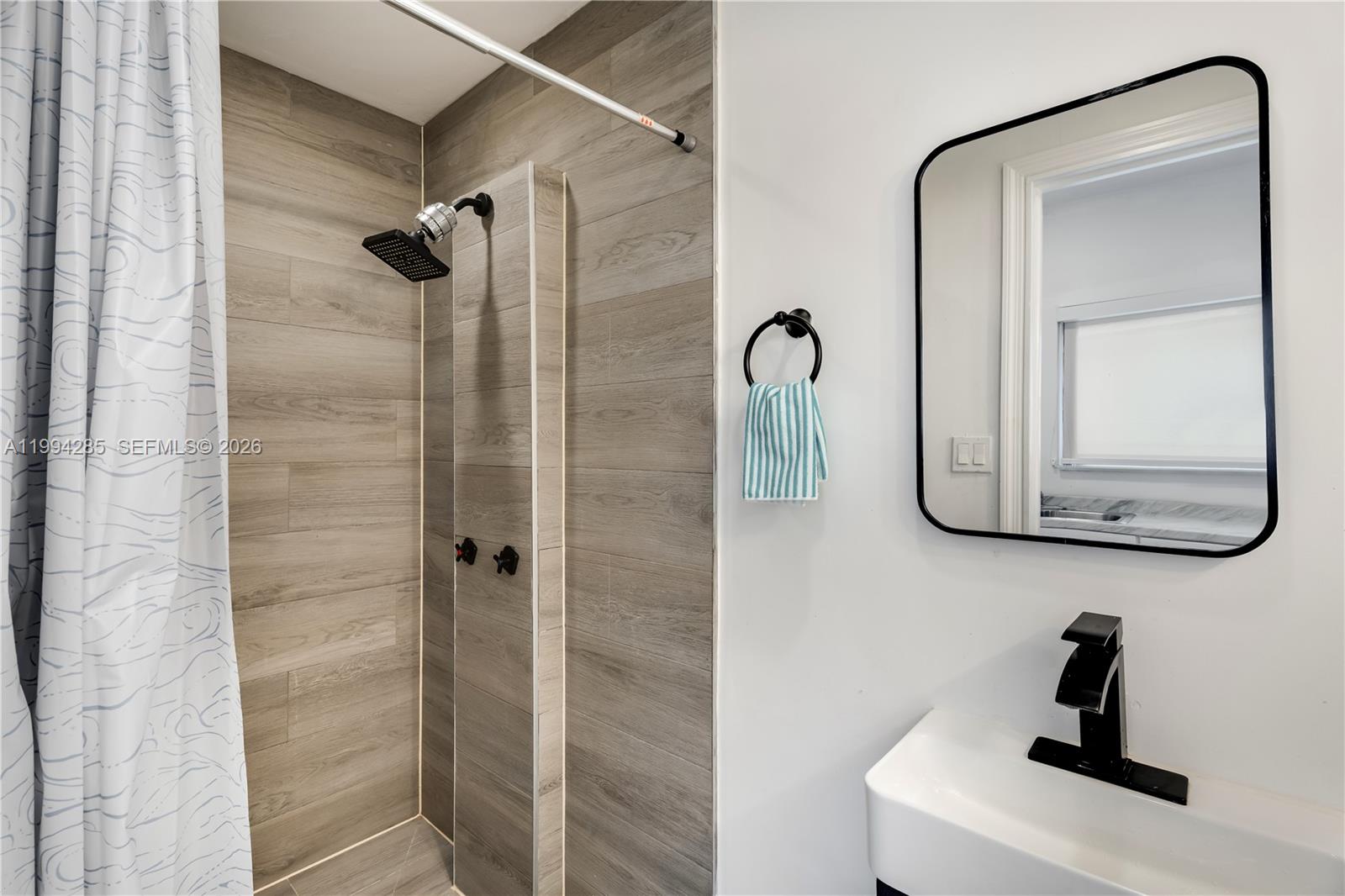 5635 Pierce Street Hollywood, FL 33021 - Photo 22 of 27 a bathroom with a shower