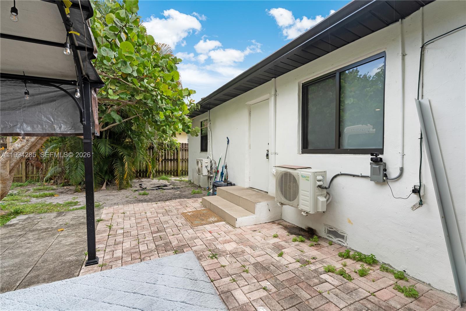 5635 Pierce Street Hollywood, FL 33021 - Photo 26 of 27 a bathroom with a sink and a mirror