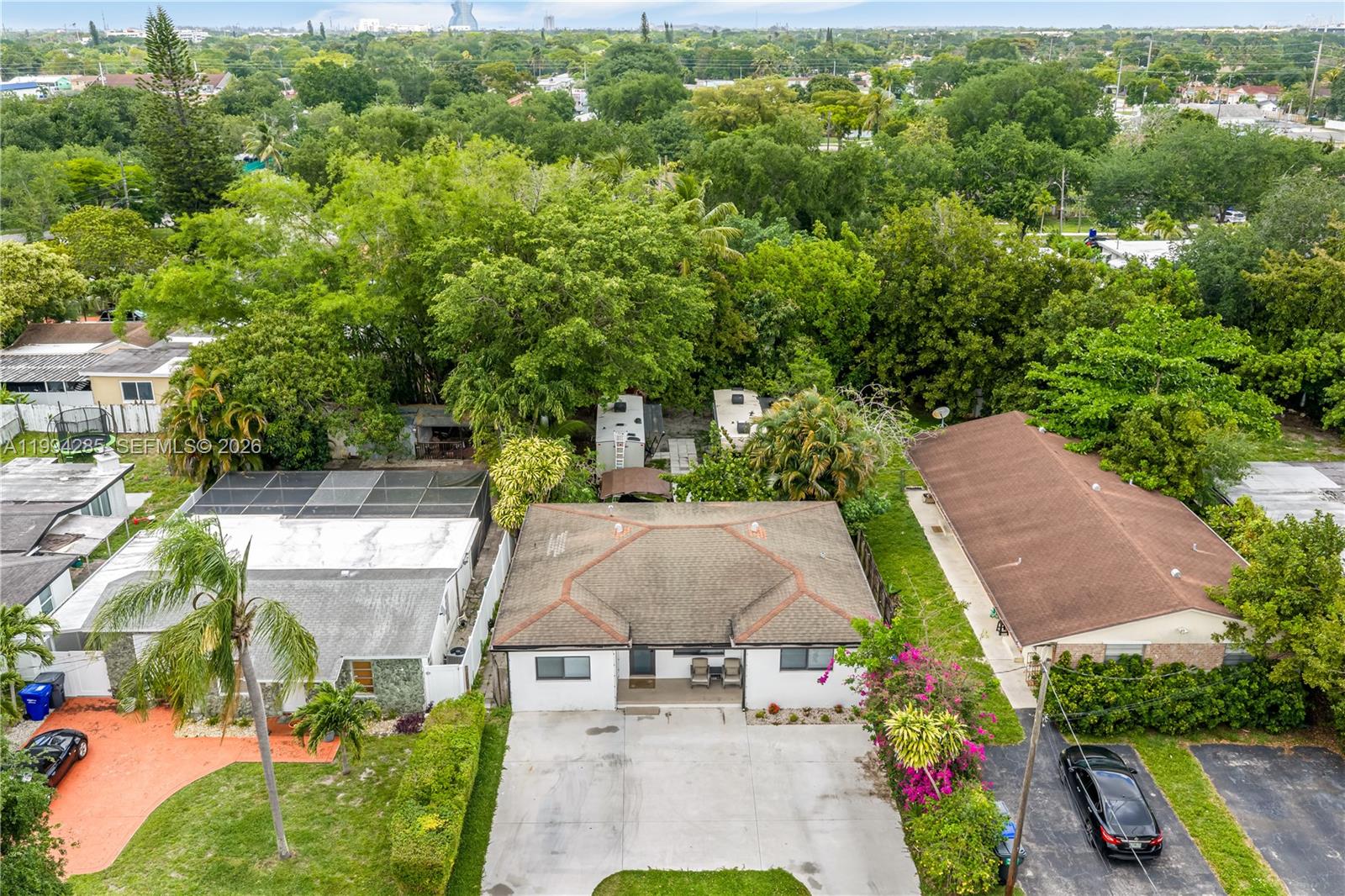5635 Pierce Street Hollywood, FL 33021 - Photo 3 of 27 an aerial view of multiple houses with a yard