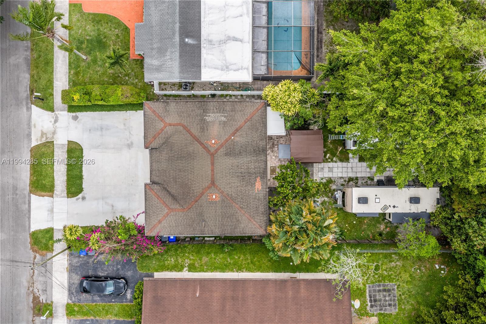 5635 Pierce Street Hollywood, FL 33021 - Photo 5 of 27 an aerial view of a house with a yard and garden