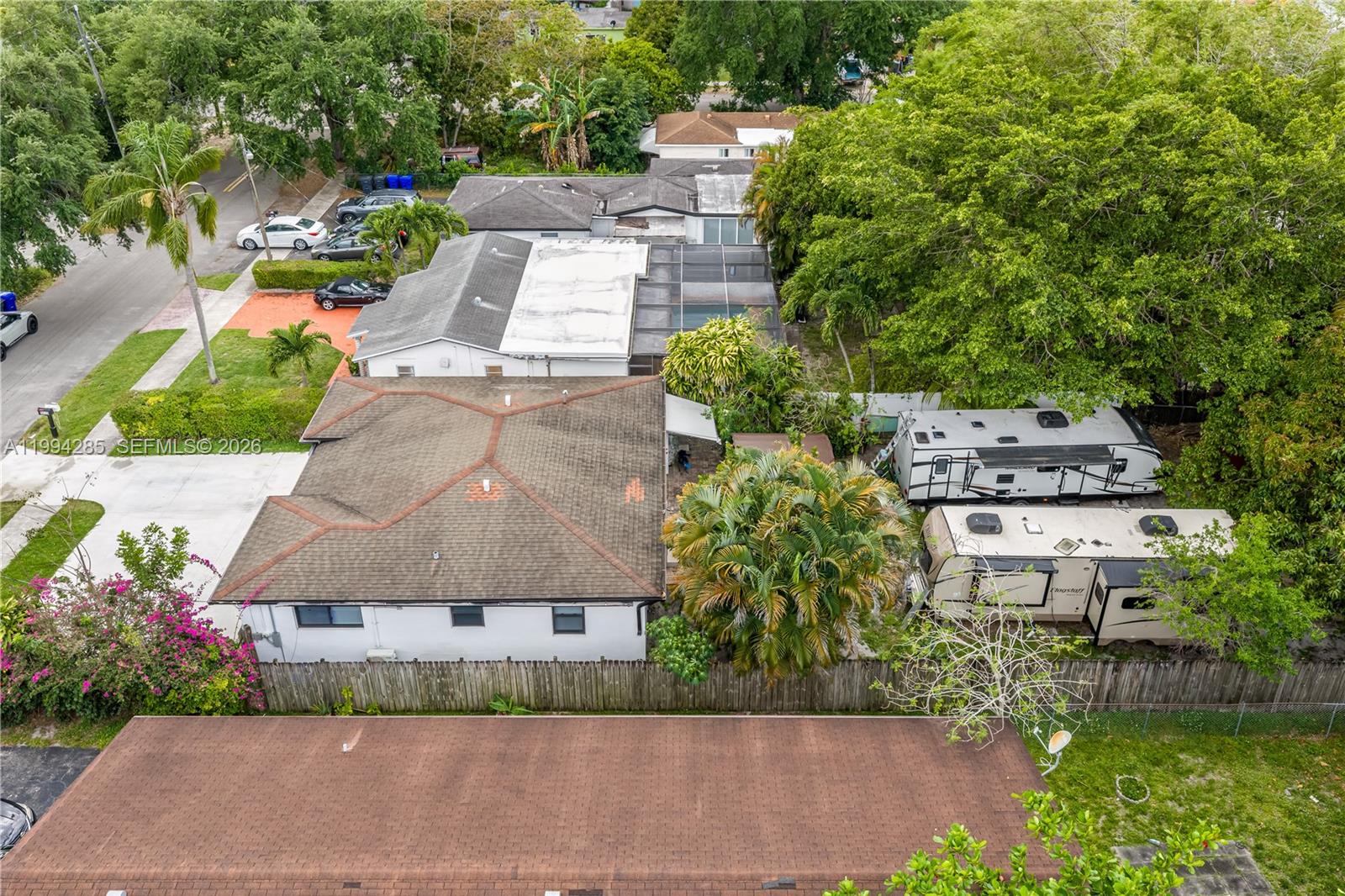5635 Pierce Street Hollywood, FL 33021 - Photo 6 of 27 an aerial view of a house with a garden and trees