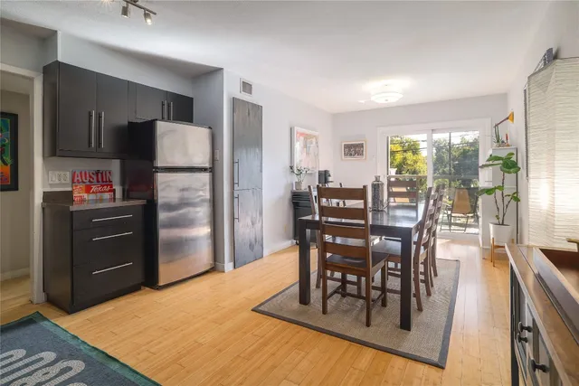 a kitchen with stainless steel appliances granite countertop a stove and a refrigerator