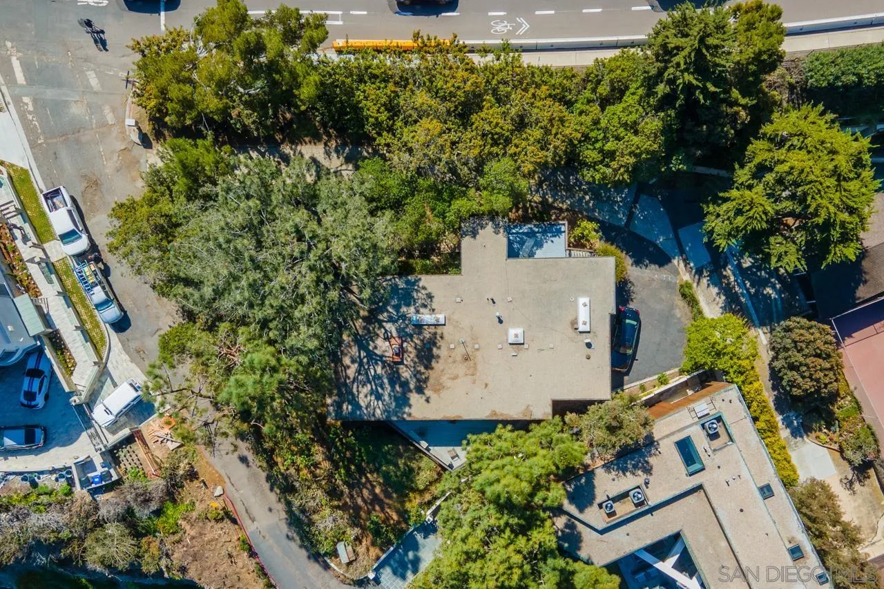 1595 Coast Walk La Jolla, CA 92037 - Photo 20 of 24 an aerial view of a house with a yard and garden