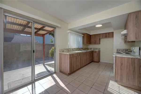 a kitchen with a cabinets and white stainless steel appliances