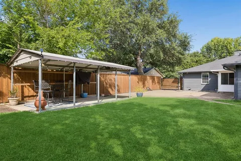 a backyard of a house with lots of green space