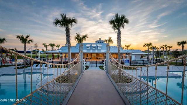 a view of swimming pool with outdoor seating and city view