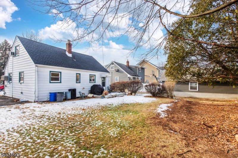 116 Edison Street Clifton, NJ 07013 - Photo 18 of 19 a view of a house with a yard covered in snow