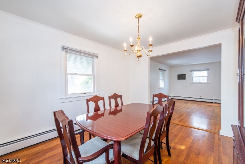 116 Edison Street Clifton, NJ 07013 - Photo 5 of 19 a view of a dining room with furniture and chandelier