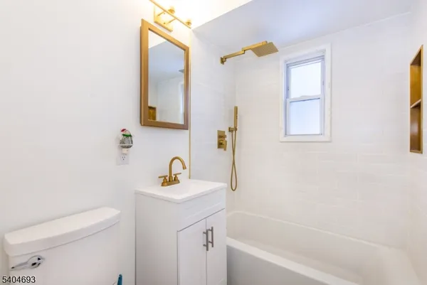 a bathroom with a sink a toilet and a bathtub