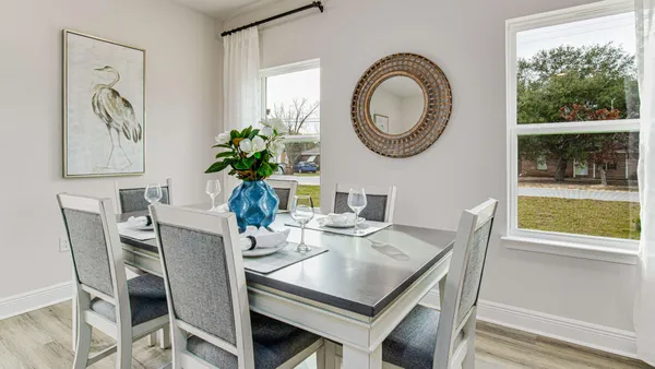 a view of a dining room with furniture window and outside view