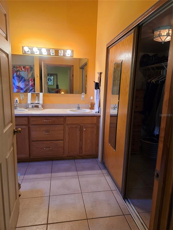 54523 Astor Transfer Station Road Astor, FL 32102 - Photo 13 of 31 a bathroom with a sink a vanity and a mirror