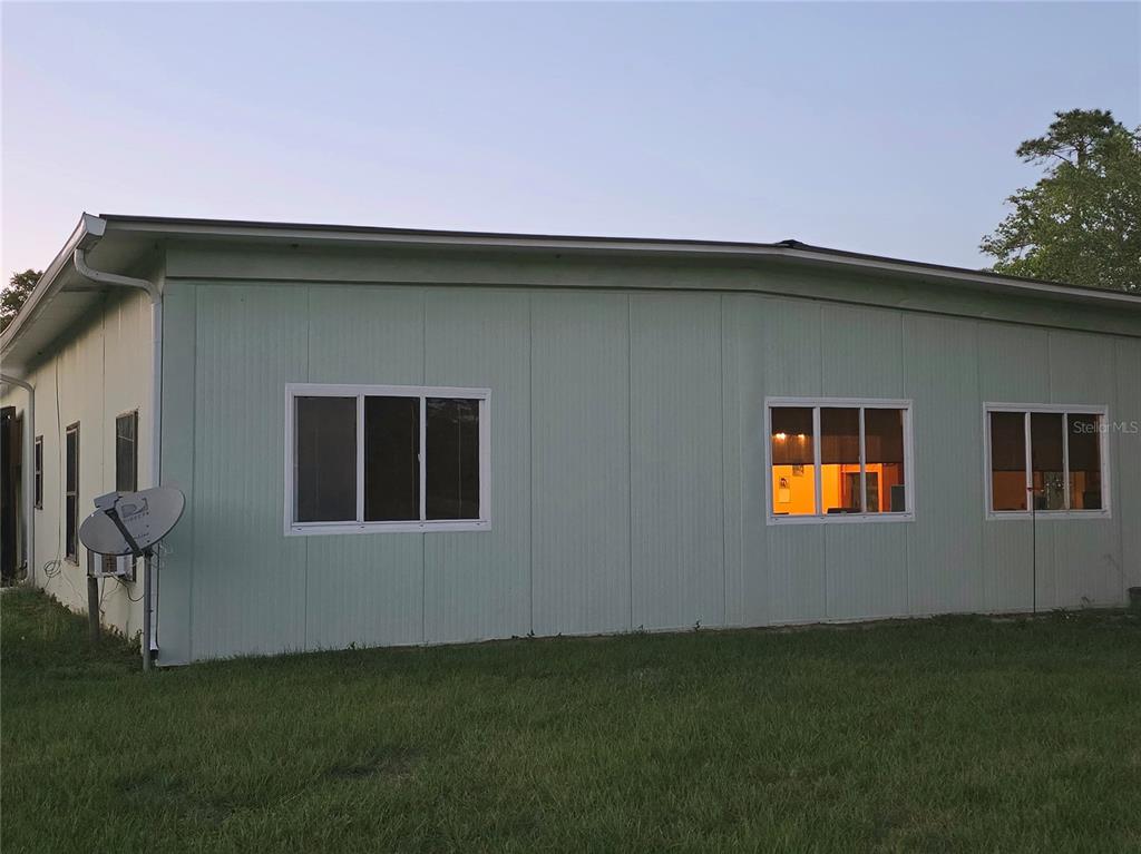 54523 Astor Transfer Station Road Astor, FL 32102 - Photo 3 of 31 a house that has a big yard