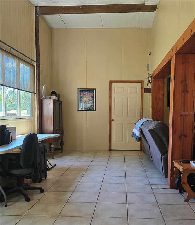 54523 Astor Transfer Station Road Astor, FL 32102 - Photo 8 of 31 a view of a workspace with furniture and a window