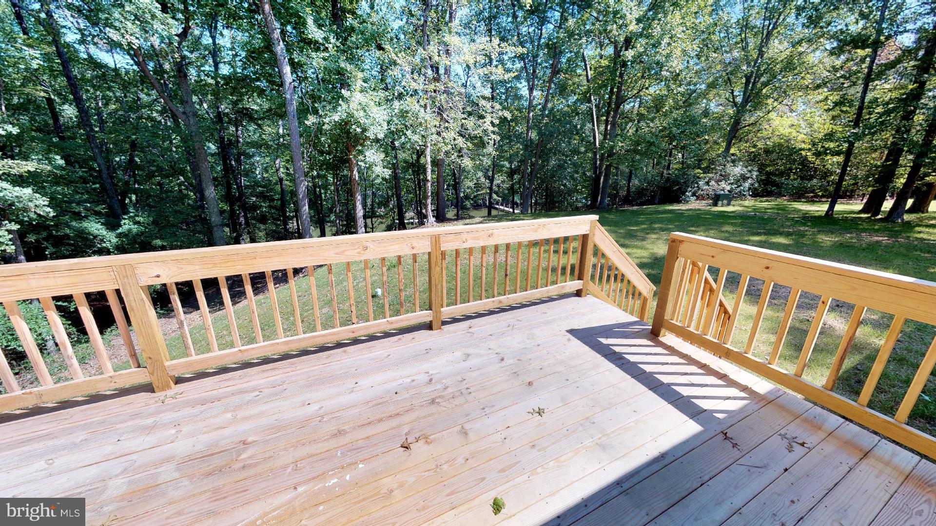 13284 Joy Road Lusby, MD 20657 - Photo 7 of 29 a view of wooden deck with a big yard