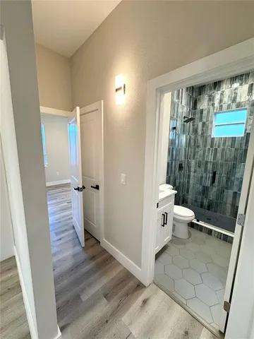 a bathroom with a sink and toilet