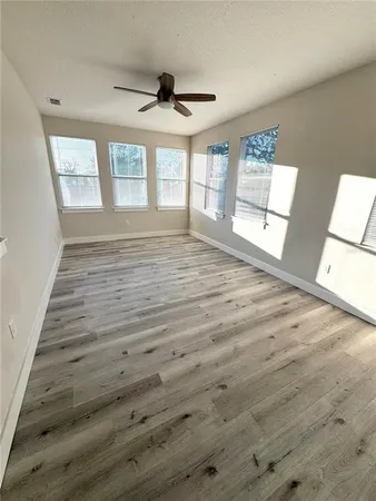 a view of an empty room with a window