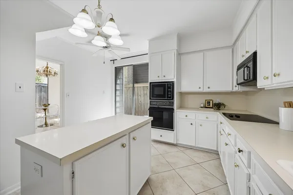 a kitchen with a sink stove and refrigerator