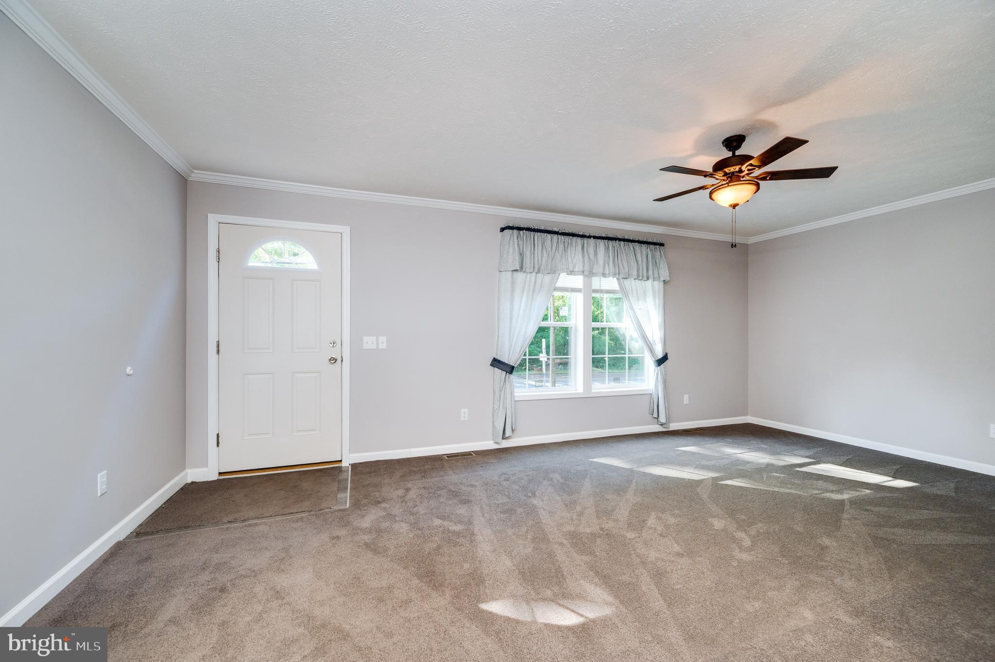 875 Mohrsville Road Shoemakersville, PA 19555 - Photo 11 of 34 wooden floor in an empty room with a window
