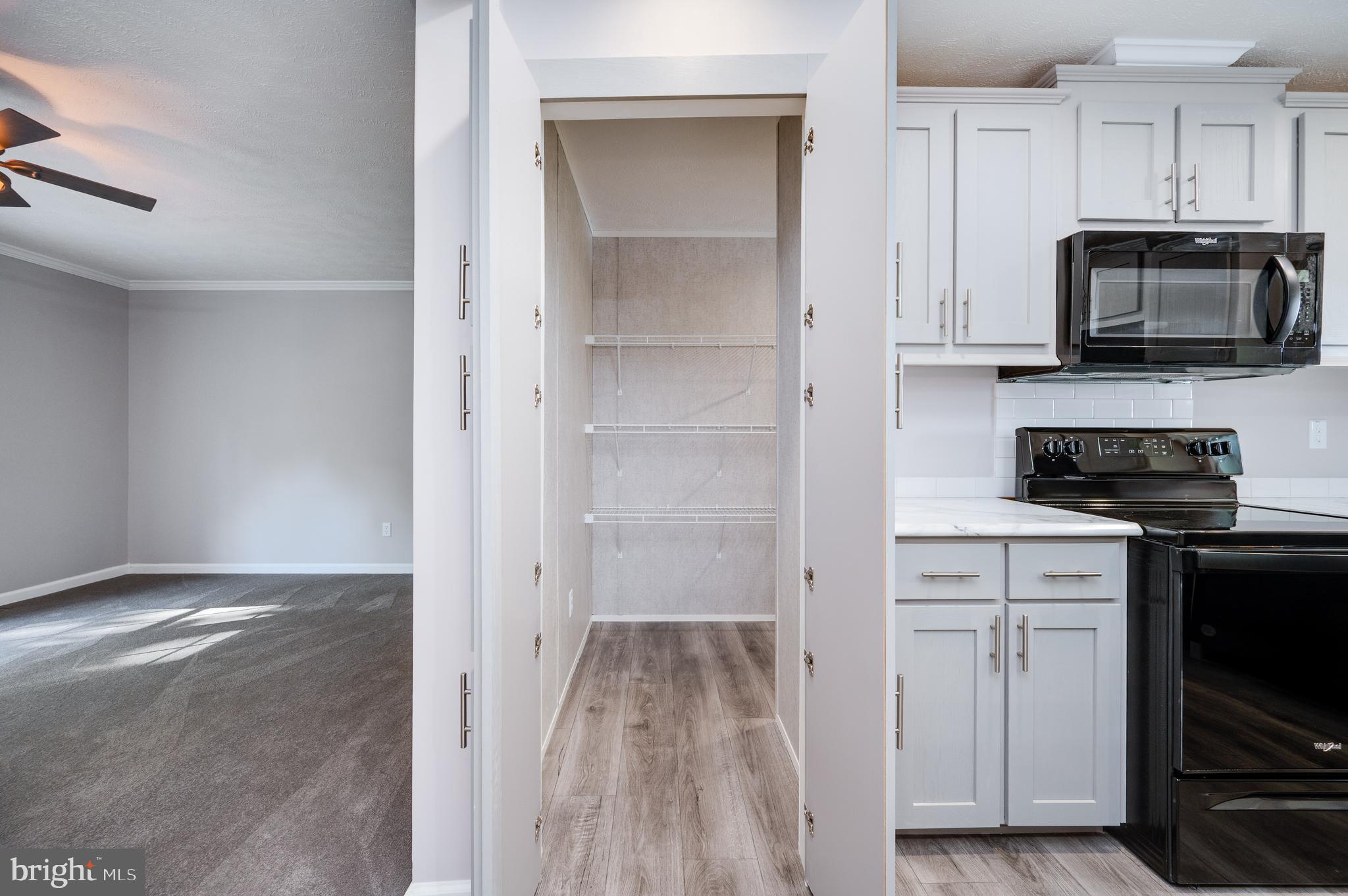875 Mohrsville Road Shoemakersville, PA 19555 - Photo 17 of 34 a kitchen with stainless steel appliances granite countertop a stove and a refrigerator