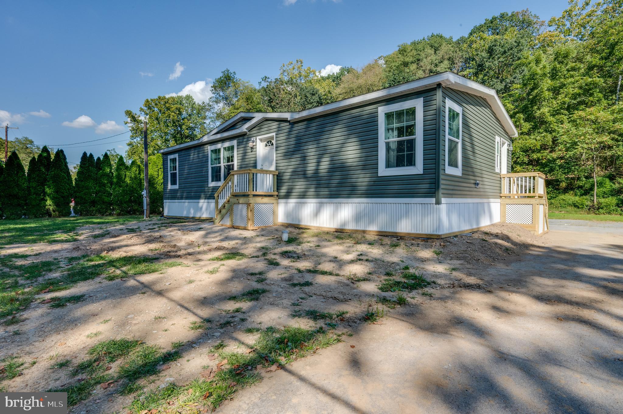 875 Mohrsville Road Shoemakersville, PA 19555 - Photo 2 of 34 a front view of a house with a yard and garage