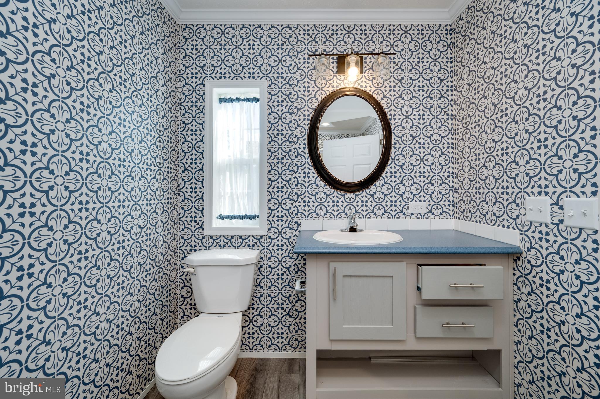 875 Mohrsville Road Shoemakersville, PA 19555 - Photo 25 of 34 a bathroom with a granite countertop toilet sink and mirror
