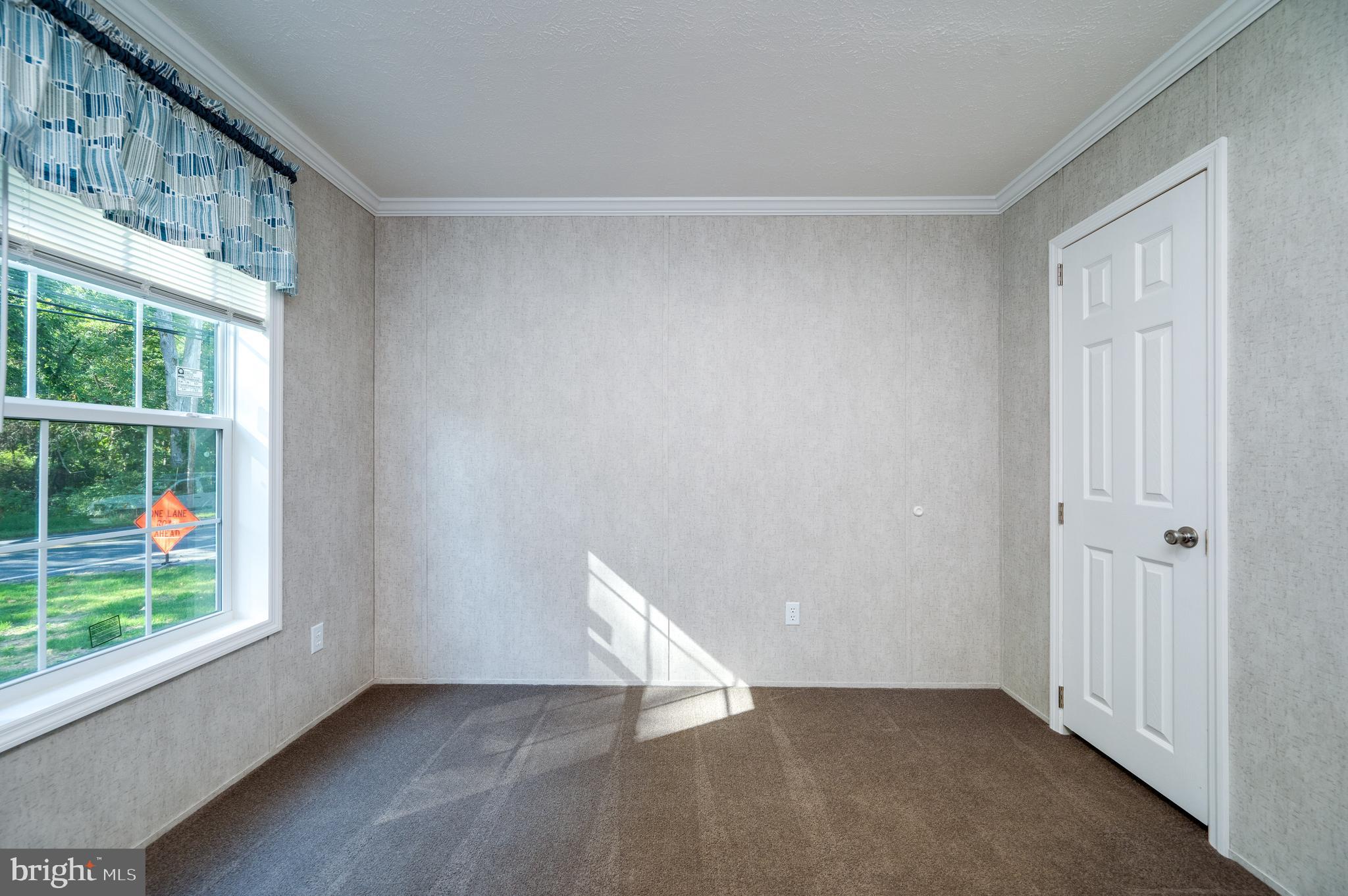 875 Mohrsville Road Shoemakersville, PA 19555 - Photo 28 of 34 a view of an empty room with wooden floor and a window