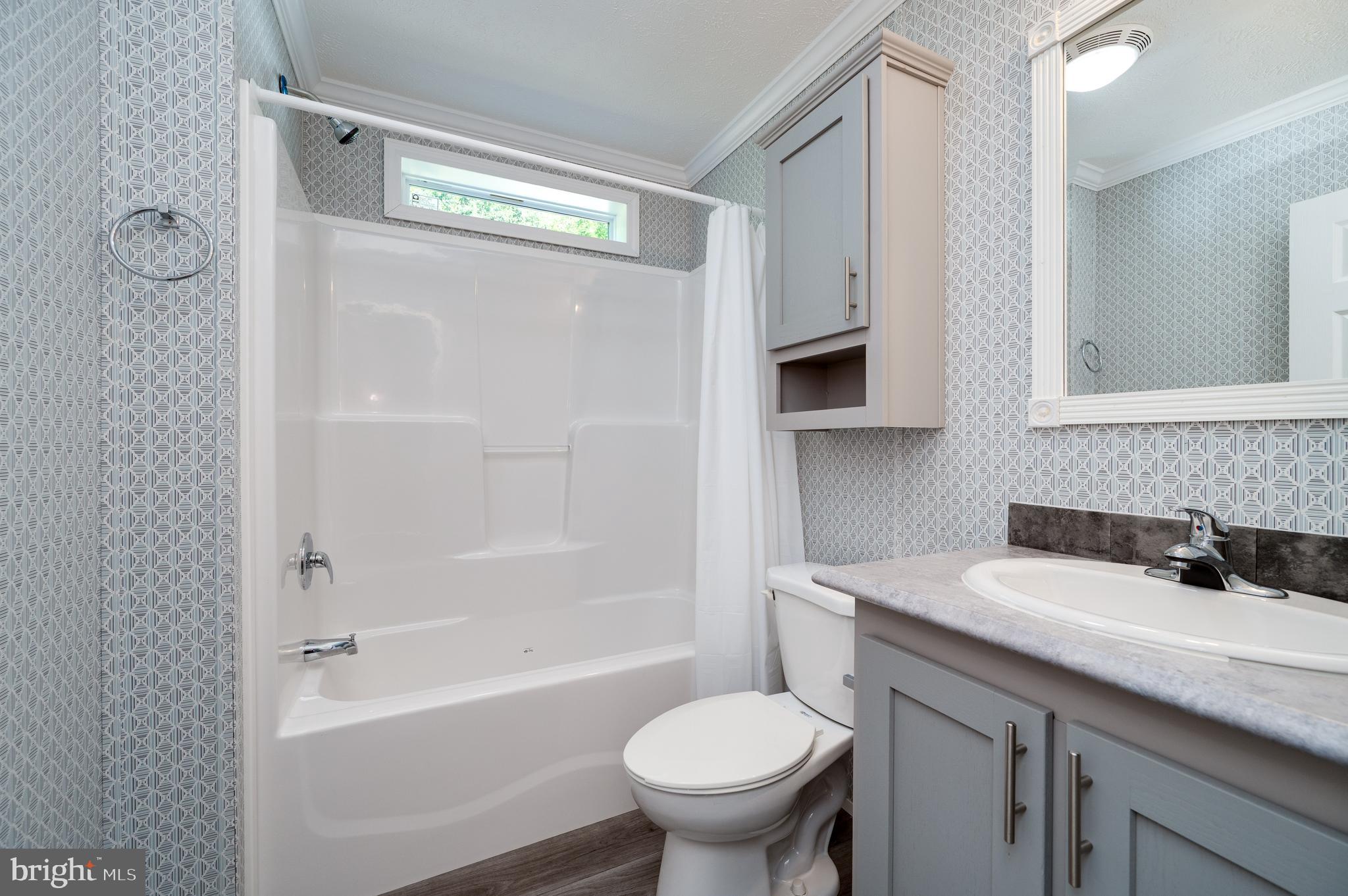 875 Mohrsville Road Shoemakersville, PA 19555 - Photo 32 of 34 a bathroom with a sink a toilet and a bathtub