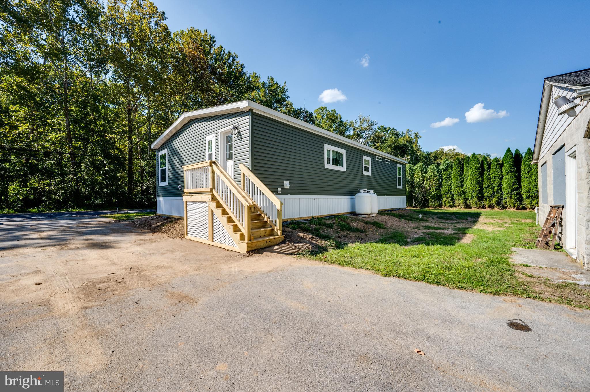 875 Mohrsville Road Shoemakersville, PA 19555 - Photo 4 of 34 a front view of a house with a yard