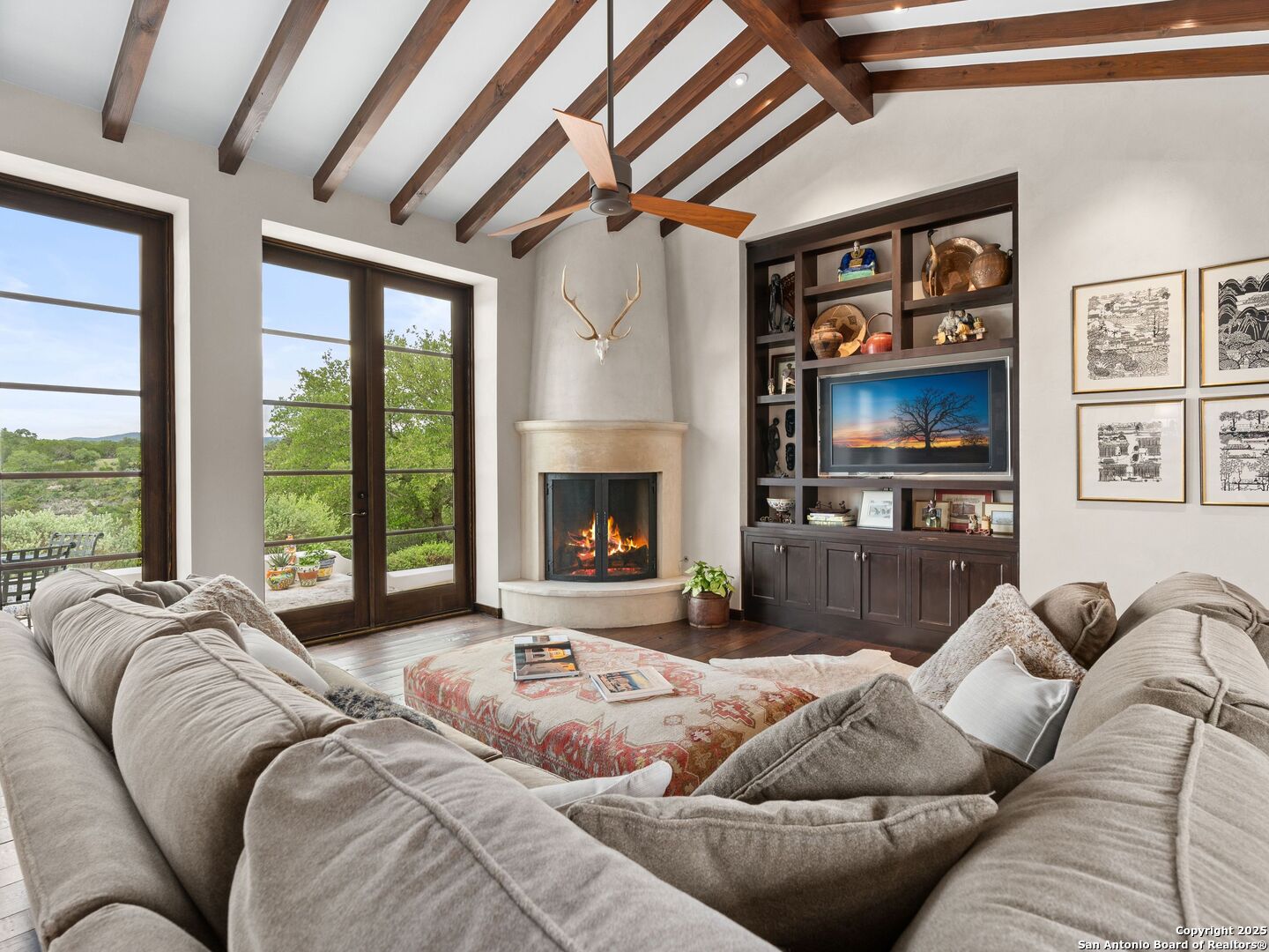 2835 Palomino Springs Bandera, TX 78003 - Photo 12 of 77 a living room with furniture ceiling fan and a fireplace