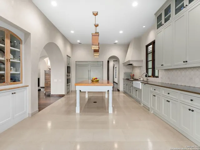 a spacious bathroom with a tub and sink
