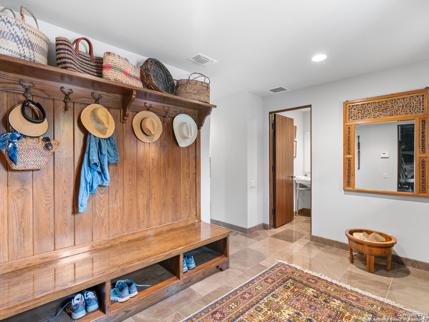 2835 Palomino Springs Bandera, TX 78003 - Photo 38 of 77 a bathroom with a sink and a mirror
