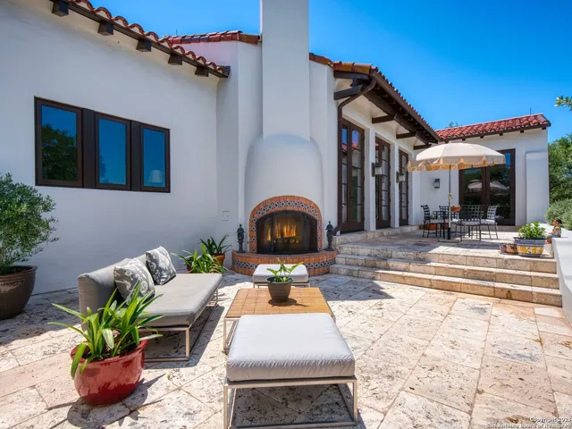 a view of a house with a big yard and plants