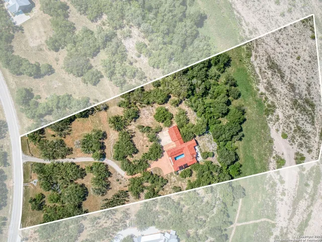 a view of a lush green space with sea